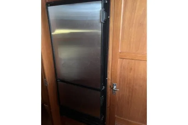 Slide: The Image of Stainless steel refrigerator in 1988 Kadey Krogen 42 yacht interior. - 6