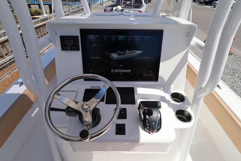 Slide: The Image of 2026 Contender 26 Bay boat console with steering wheel and digital display. - 16