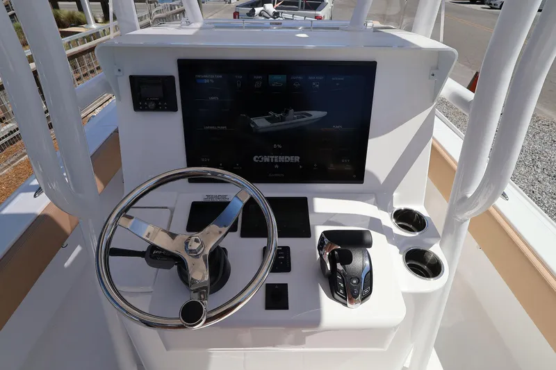 Slide: The Image of Steering console of 2026 Contender 26 Bay boat with modern controls and display. - 17
