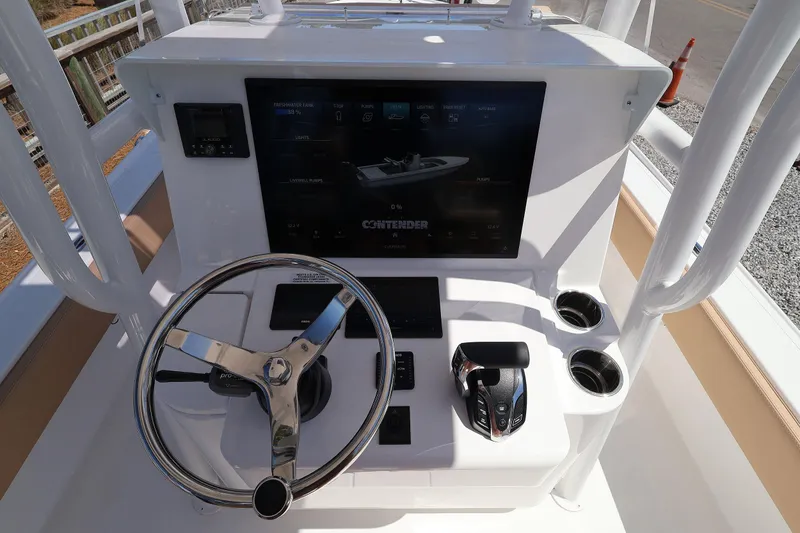 Slide: The Image of 2026 Contender 26 Bay boat console with steering wheel and digital display. - 18