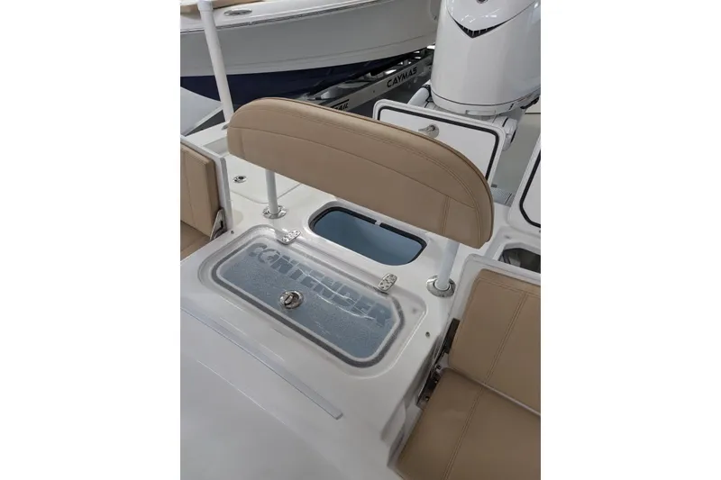 Slide: The Image of 2026 Contender 26 Bay boat interior with seating and storage compartments. - 28