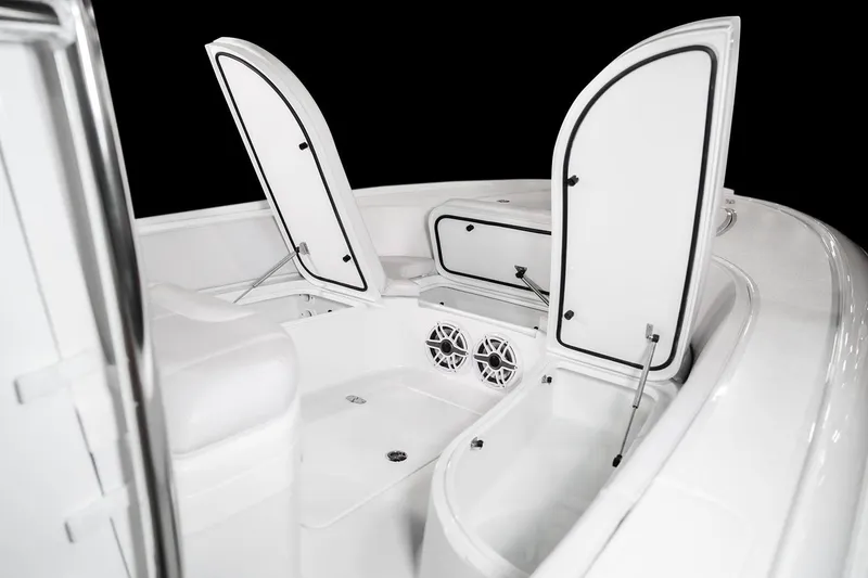 Slide: The Image of 2026 Contender 26 Bay boat displayed indoors, showcasing sleek design and modern features. - 3