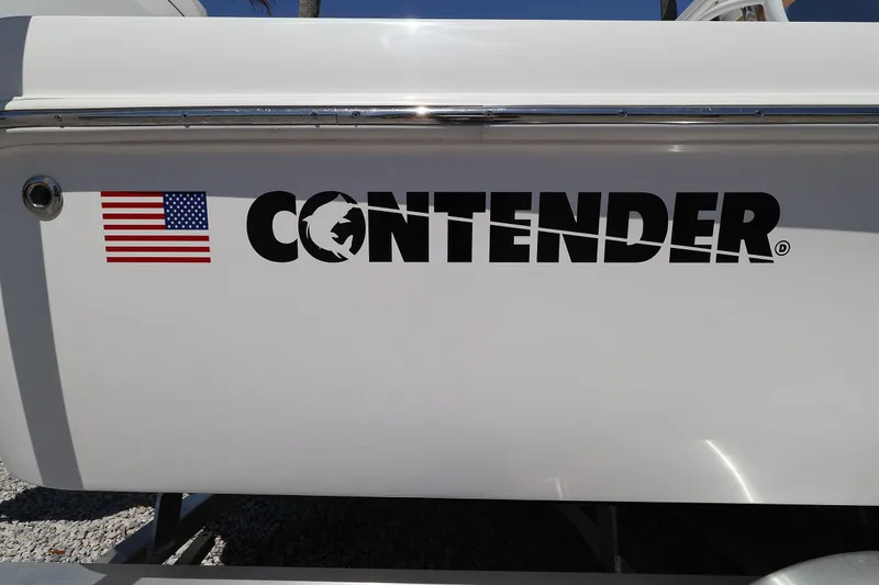 Slide: The Image of 2026 Contender 26 Bay boat with American flag logo on white hull. - 31