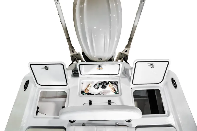 Slide: The Image of 2026 Contender 26 Bay boat interior with open storage compartments in a showroom. - 6