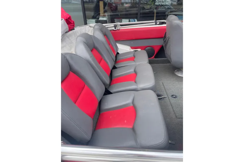 Slide: The Image of 2003 Skeeter SL 190 boat interior with gray and red seating. - 7