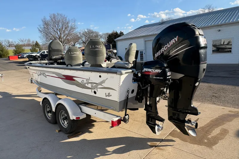 Slide: The Image of 2005 Lund 2025 Pro-V LE boat with dual Mercury outboard motors on a trailer. - 3