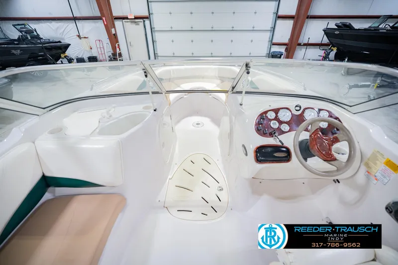 Slide: The Image of Interior view of a 2004 Tahoe 204 boat with steering wheel and dashboard. - 17
