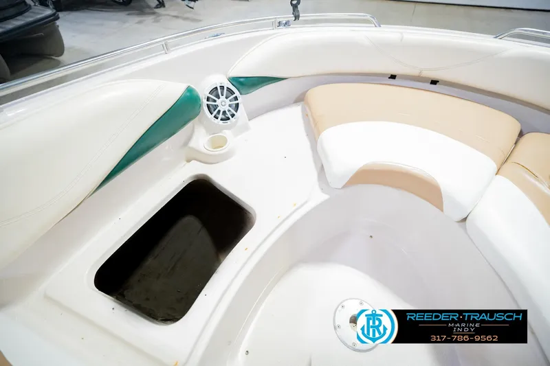 Slide: The Image of Interior of a 2004 Tahoe 204 boat with seating and speaker detail. - 27