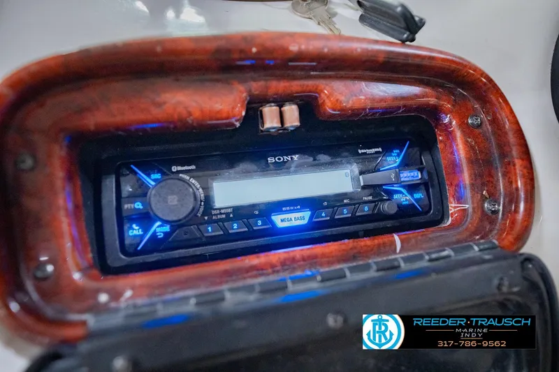 Slide: The Image of Sony stereo system in a 2004 Tahoe 204 boat dashboard with wood trim. - 31
