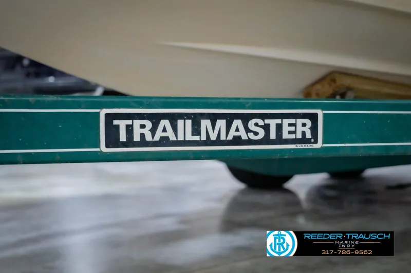 Slide: The Image of Green Trailmaster trailer for 2004 Tahoe 204 boat, Reeder Trausch Marine logo visible. - 43