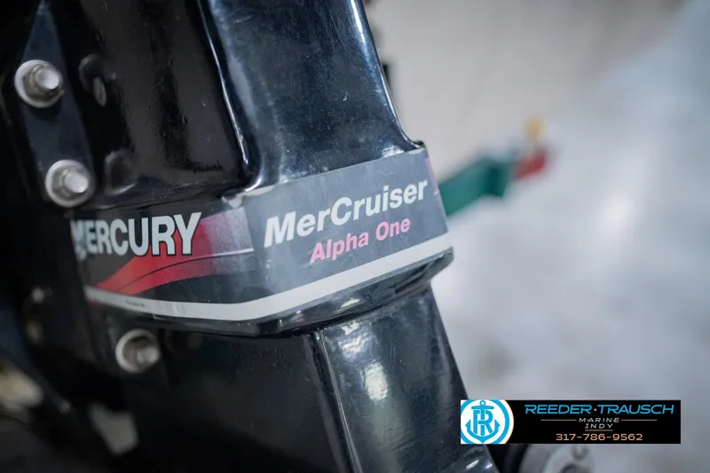 Slide: The Image of Mercury MerCruiser Alpha One engine on 2004 Tahoe 204 boat, Reeder-Trausch Marine logo visible. - 49