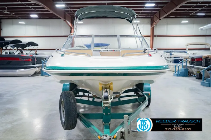 Slide: The Image of 2004 Tahoe 204 boat on trailer in indoor showroom, Reeder Trausch Marine. - 5