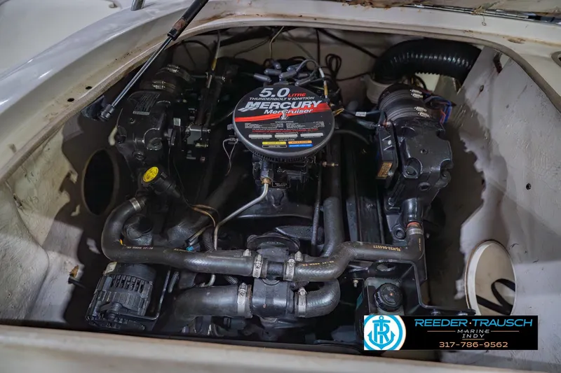 Slide: The Image of Engine compartment of a 2004 Tahoe 204 boat with MerCruiser 5.0L engine. - 50
