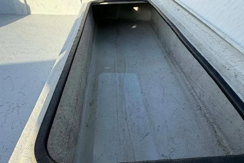 Slide: The Image of 2021 Blazer Bay 2420 boat storage compartment, spacious and clean interior. - 11