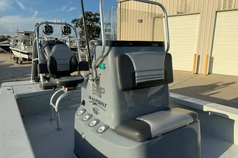 Slide: The Image of 2021 Blazer Bay 2420 boat interior with seating and control panel. - 13