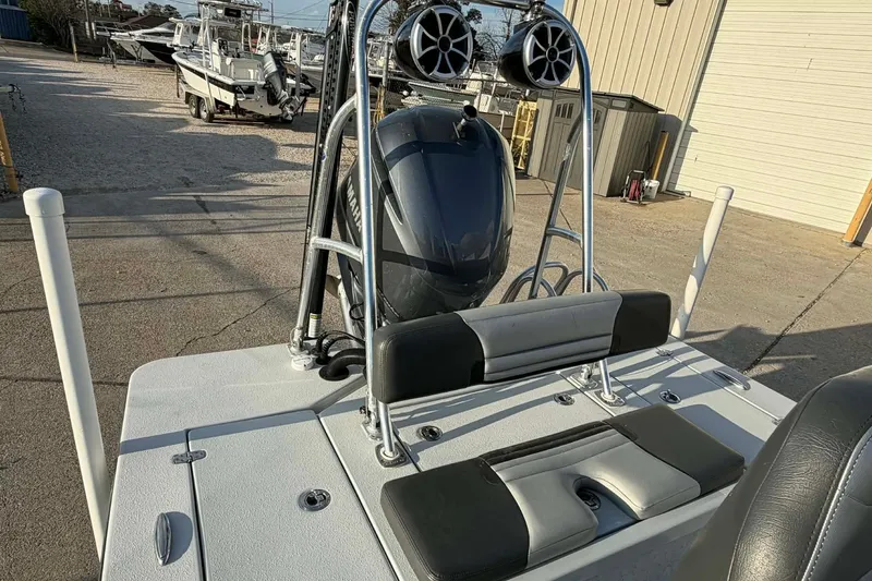 Slide: The Image of 2021 Blazer Bay 2420 boat with Yamaha engine and speakers, docked outdoors. - 17