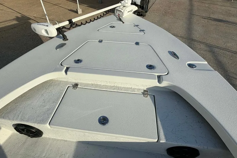 Slide: The Image of 2021 Blazer Bay 2420 boat deck with storage compartments and trolling motor. - 21