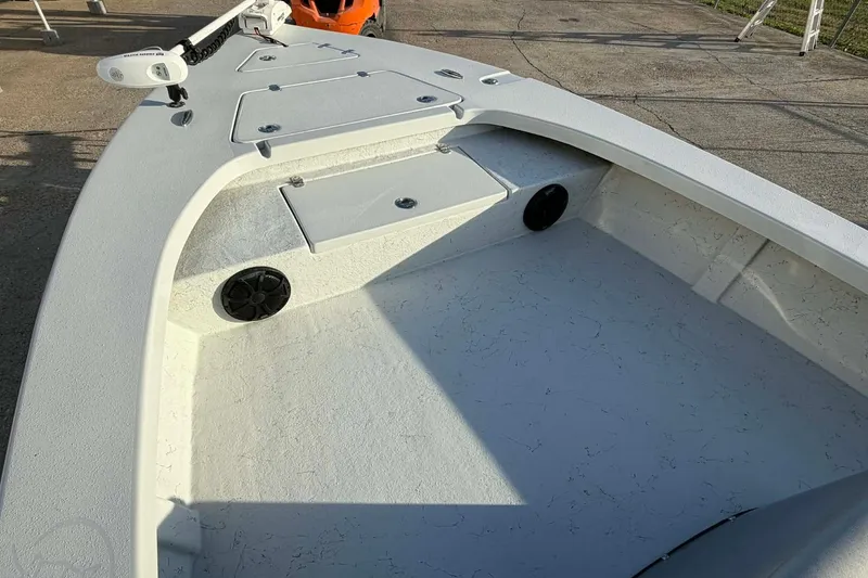 Slide: The Image of 2021 Blazer Bay 2420 boat interior with storage compartments and speakers. - 26