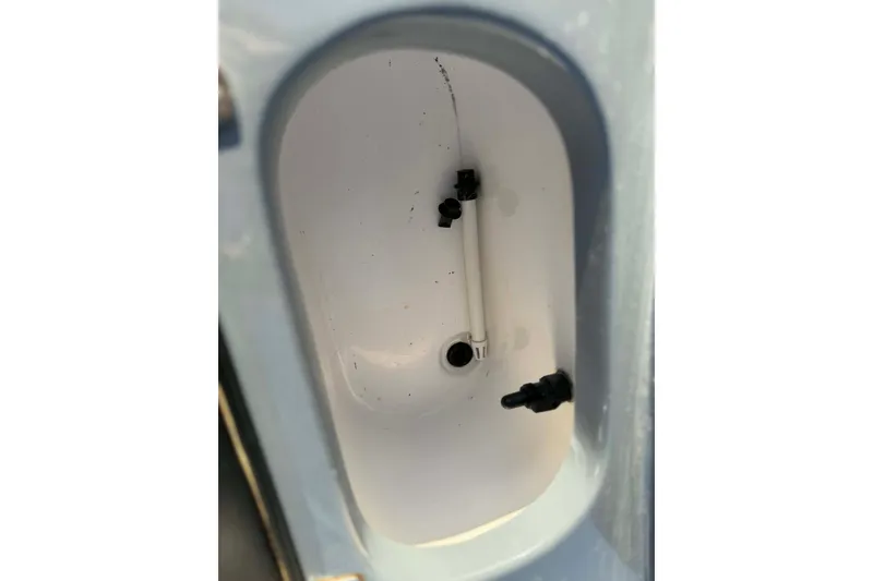 Slide: The Image of 2021 Blazer Bay 2420 boat livewell interior with fittings and drain. - 27