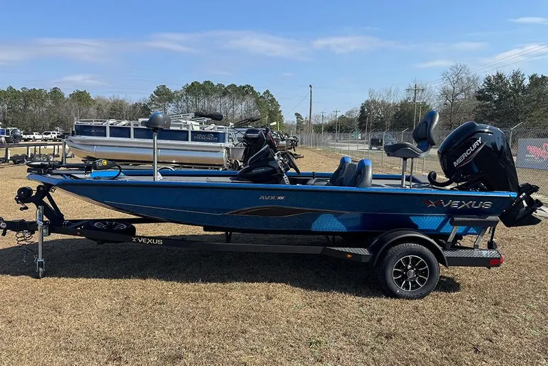 The Image of 2026 Vexus Defender 181 boat with Mercury engine on trailer, parked outdoors. - 1