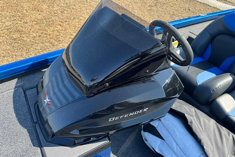 Slide: The Image of 2026 Vexus Defender 181 boat console with steering wheel and seating. - 18