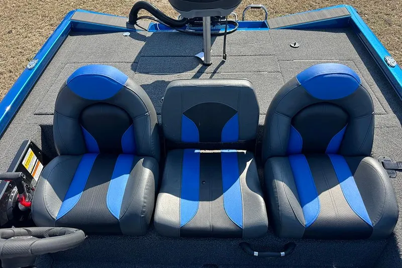 Slide: The Image of 2026 Vexus Defender 181 boat interior with blue and black seating arrangement. - 19