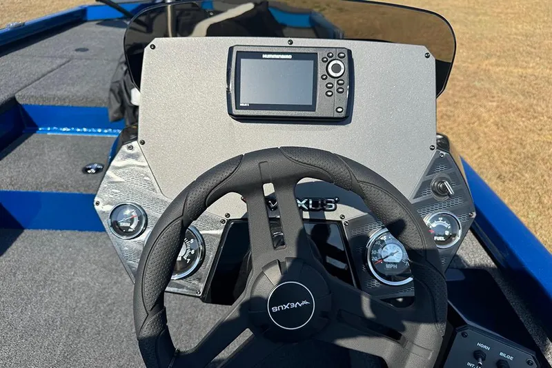 Slide: The Image of Steering console of 2026 Vexus Defender 181 boat with modern controls and display. - 22