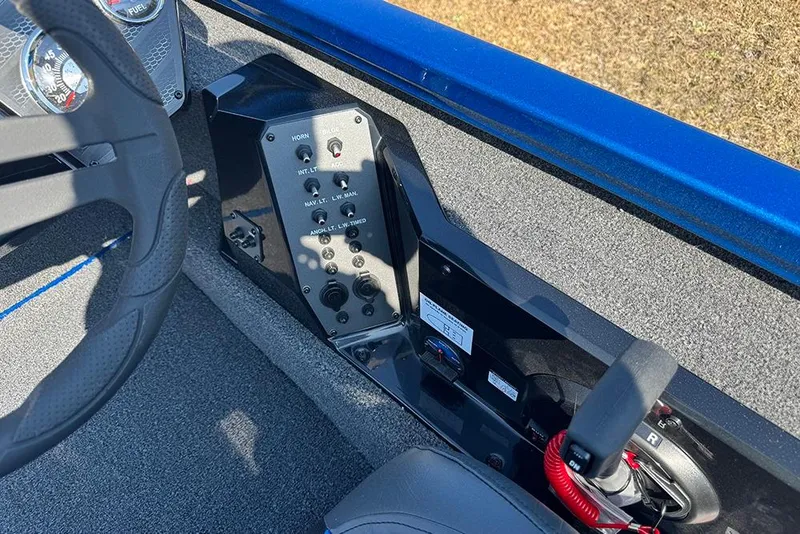 Slide: The Image of 2026 Vexus Defender 181 boat dashboard with steering wheel and control panel. - 23