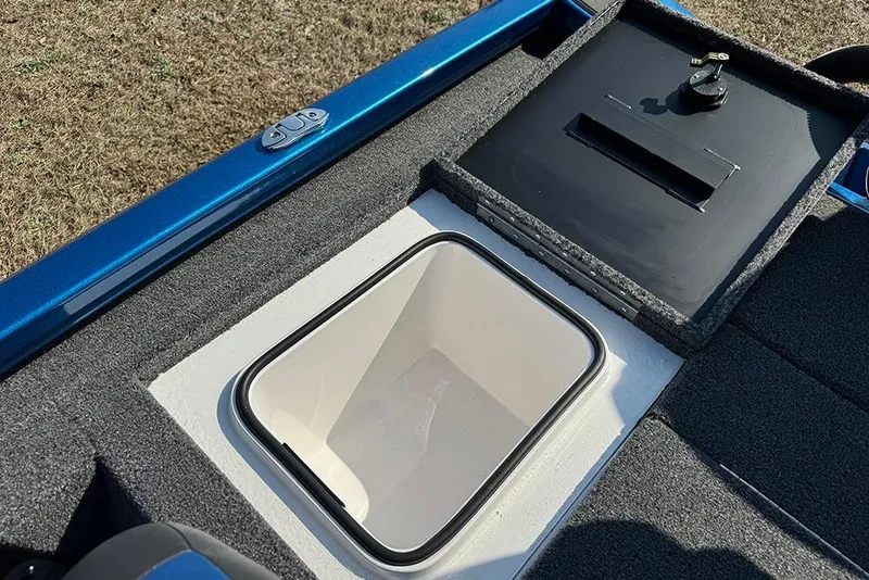 Slide: The Image of 2026 Vexus Defender 181 boat storage compartment with open hatch, showcasing interior design. - 26