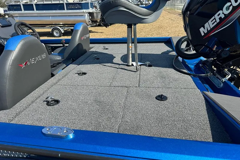 Slide: The Image of 2026 Vexus Defender 181 boat interior with Mercury engine and seating. - 28