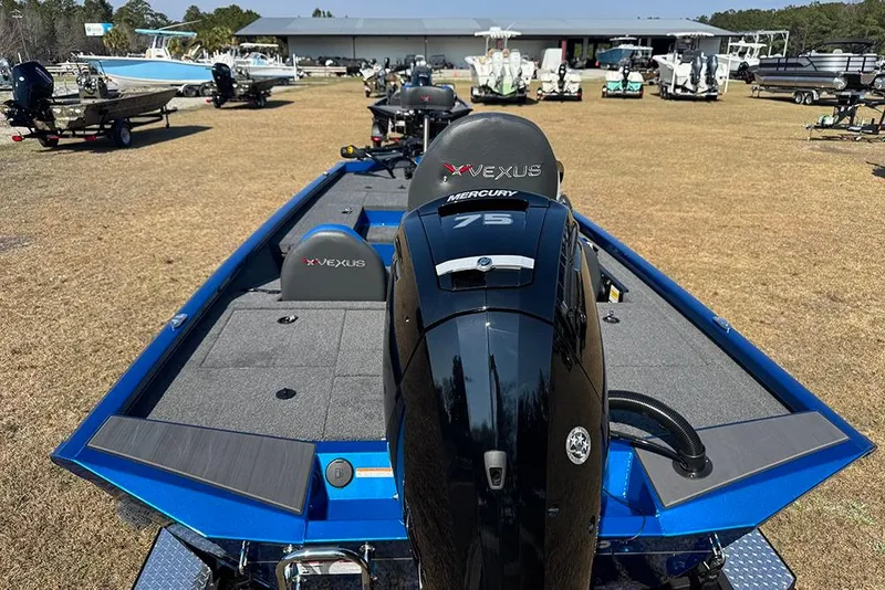 Slide: The Image of 2026 Vexus Defender 181 boat with Mercury 75 engine, displayed outdoors. - 3