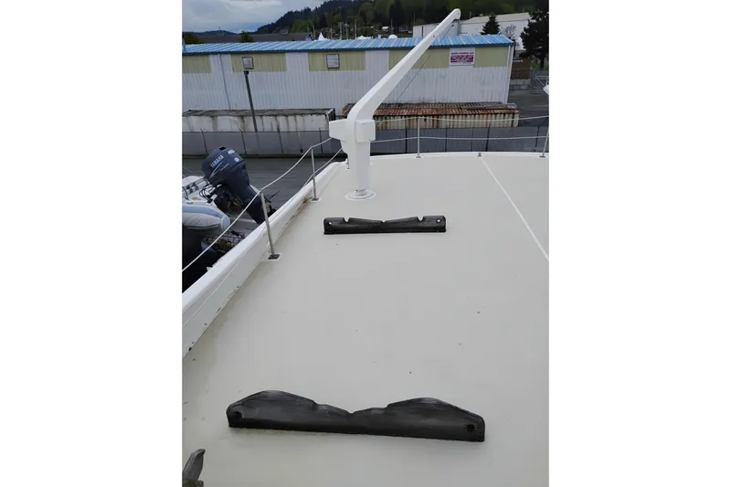 Slide: The Image of Deck of 1977 Custom International Offshore 65 yacht with railing and equipment. - 15