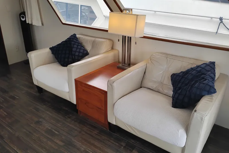 Slide: The Image of Luxurious 1977 Custom International Offshore 65 yacht interior with cozy seating and elegant decor. - 20