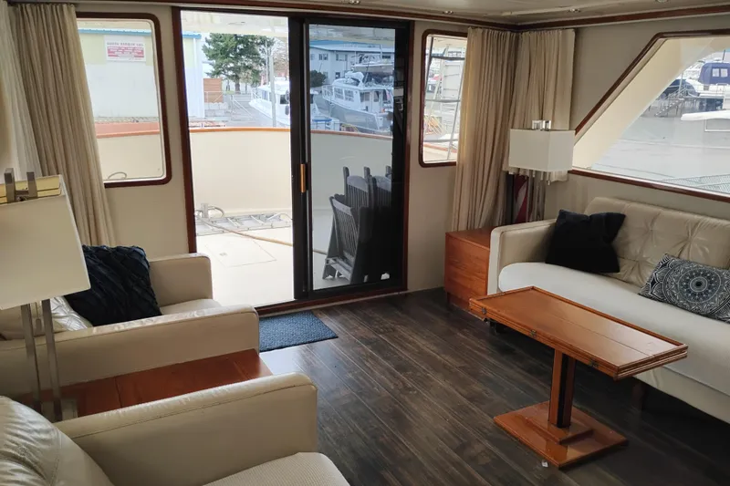 Slide: The Image of Luxurious interior of 1977 Custom International Offshore 65 yacht with elegant furnishings. - 21