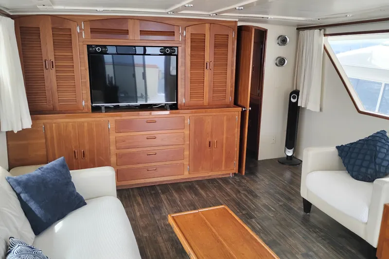 Slide: The Image of Interior of 1977 Custom International Offshore 65 yacht with wood cabinetry and modern furnishings. - 24