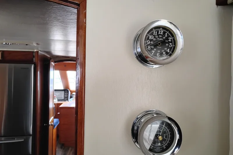 Slide: The Image of Interior of 1977 Custom International Offshore 65 yacht with clock and barometer. - 27