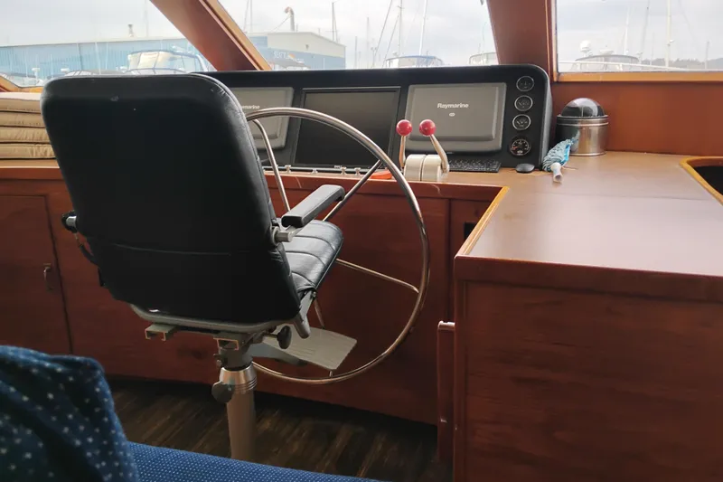 Slide: The Image of Helm of 1977 Custom International Offshore 65 yacht with navigation equipment. - 37