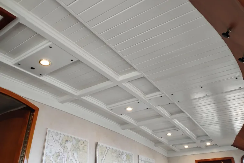 Slide: The Image of Ceiling of 1977 Custom International Offshore 65 yacht with recessed lighting and nautical maps. - 41