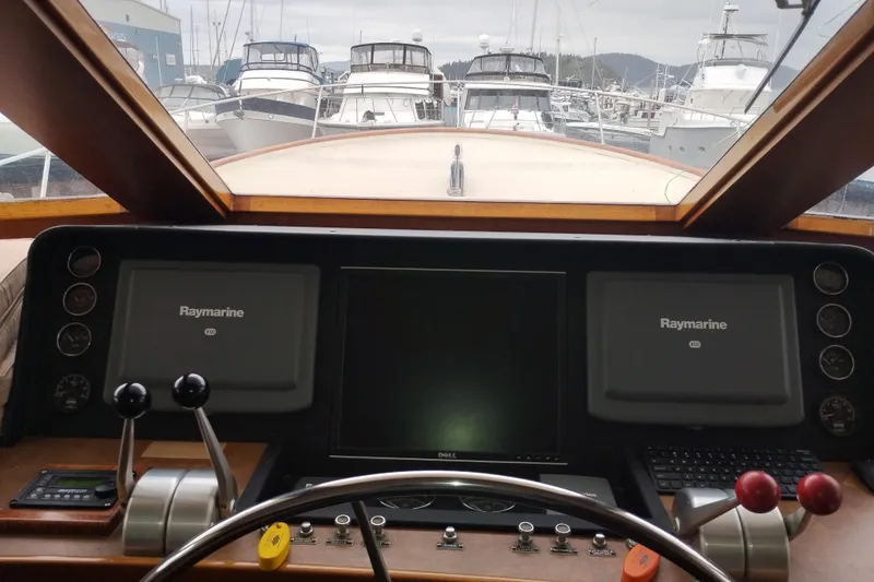 Slide: The Image of Cockpit view of 1977 Custom International Offshore 65 yacht with navigation equipment. - 44