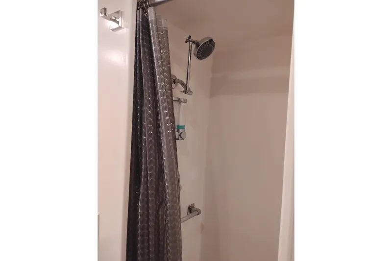 Slide: The Image of Shower area with curtain in 1977 Custom International Offshore 65 yacht. - 65