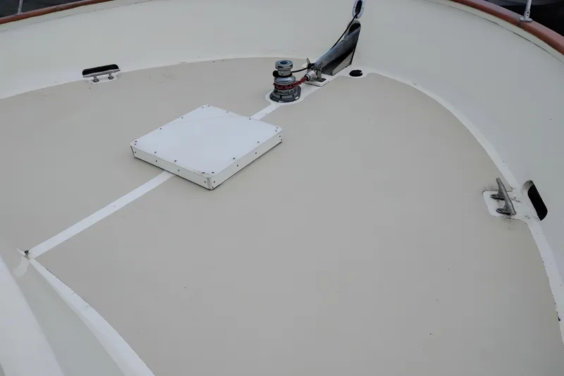Slide: The Image of Deck of 1977 Custom International Offshore 65 boat with winch and hatch. - 7