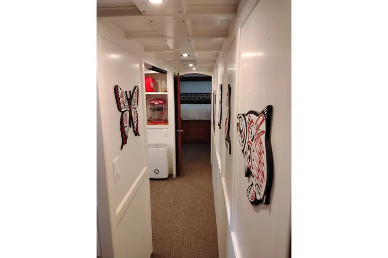 Slide: The Image of Hallway of 1977 Custom International Offshore 65 yacht with decorative wall art. - 71
