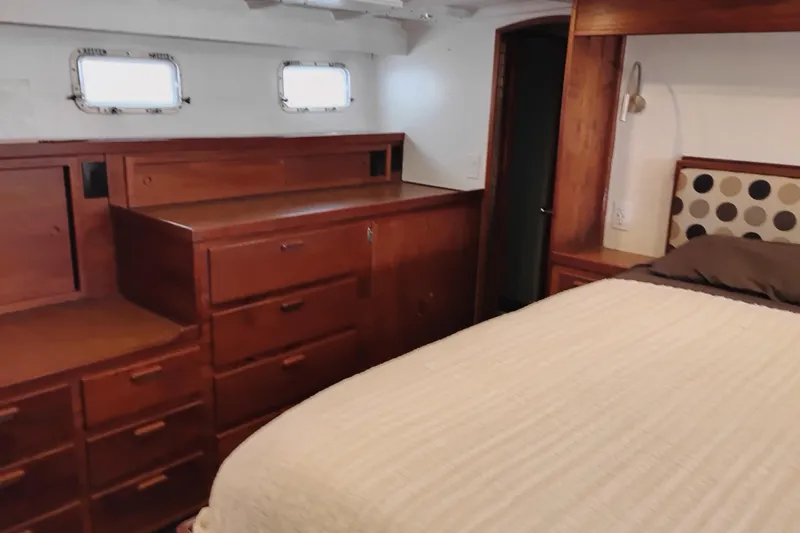 Slide: The Image of Cozy cabin interior of 1977 Custom International Offshore 65 yacht with wooden furnishings. - 73