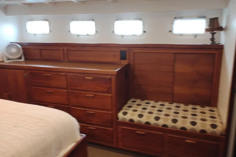 Slide: The Image of Interior of 1977 Custom International Offshore 65 yacht with wooden cabinetry and seating. - 75