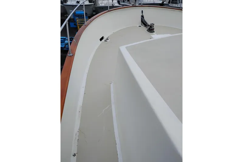 Slide: The Image of Deck view of 1977 Custom International Offshore 65 yacht, showcasing sleek design and craftsmanship. - 9