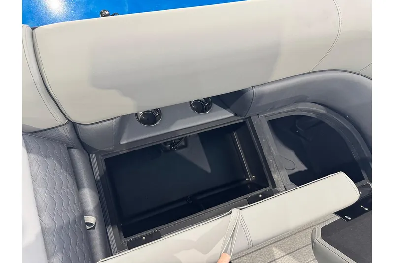 Slide: The Image of 2026 Bentley Pontoons Elite 223 Admiral interior storage compartment with gray seating. - 13