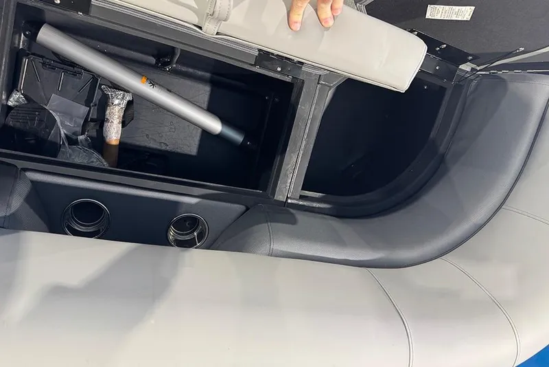 Slide: The Image of 2026 Bentley Pontoons Elite 223 Admiral interior storage compartment with seating and ventilation. - 16