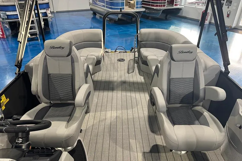 Slide: The Image of 2026 Bentley Pontoons Elite 223 Admiral interior with luxurious seating and modern design. - 19