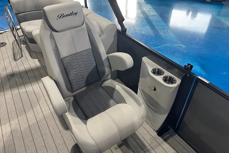 Slide: The Image of 2026 Bentley Pontoons Elite 223 Admiral interior with luxurious seating and cup holders. - 20