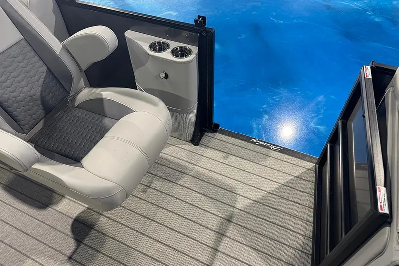 Slide: The Image of 2026 Bentley Pontoons Elite 223 Admiral interior with luxurious seating and cup holders. - 21
